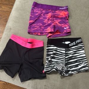Nike women's workout short shorts - 2 pair Nike pro 3" and 1 pair Nike.